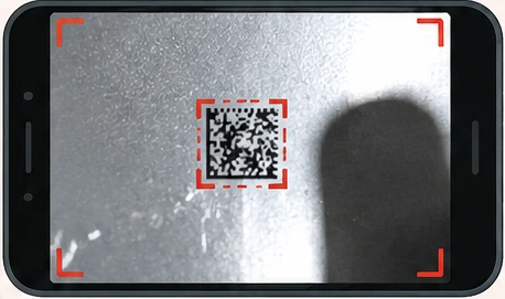 Code too small in the frame, glare and a phone shadow